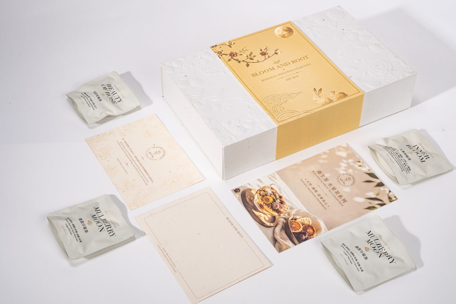 Bloom and Root Mid-Autumn gift set flat lay with tea sachets and gift cards