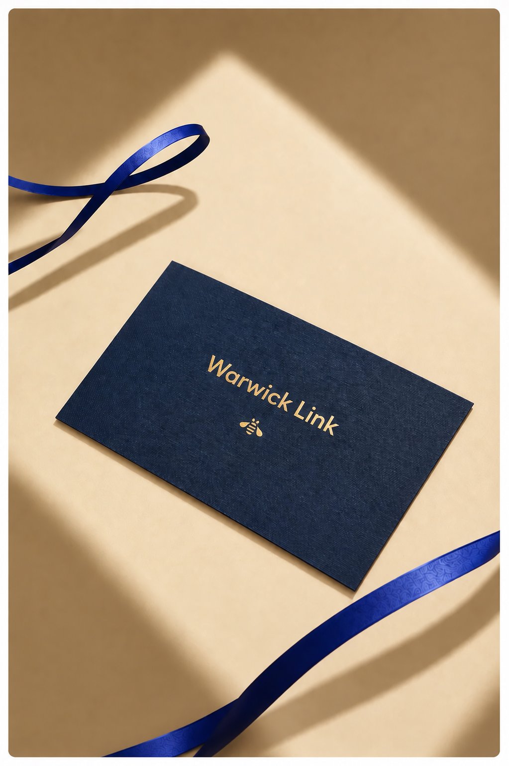 Gift card with gold Warwick Link bee emblem and logo